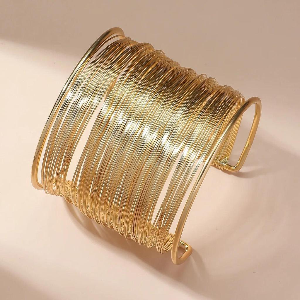 Open Bracelet with Spiral in Gold