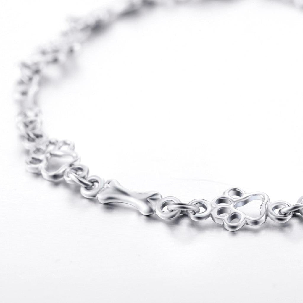 Bracelet with Dog Paw and Bone Pendants in White Gold