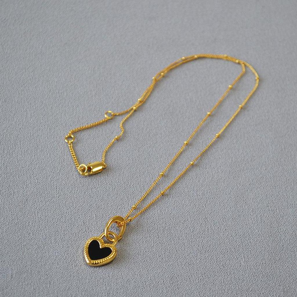 Necklace with Black White Heart Pendant in Gold