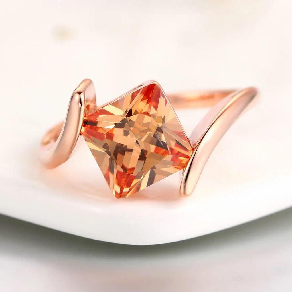 Ring with Orange Stone in Pyramid Shape in Rose Gold