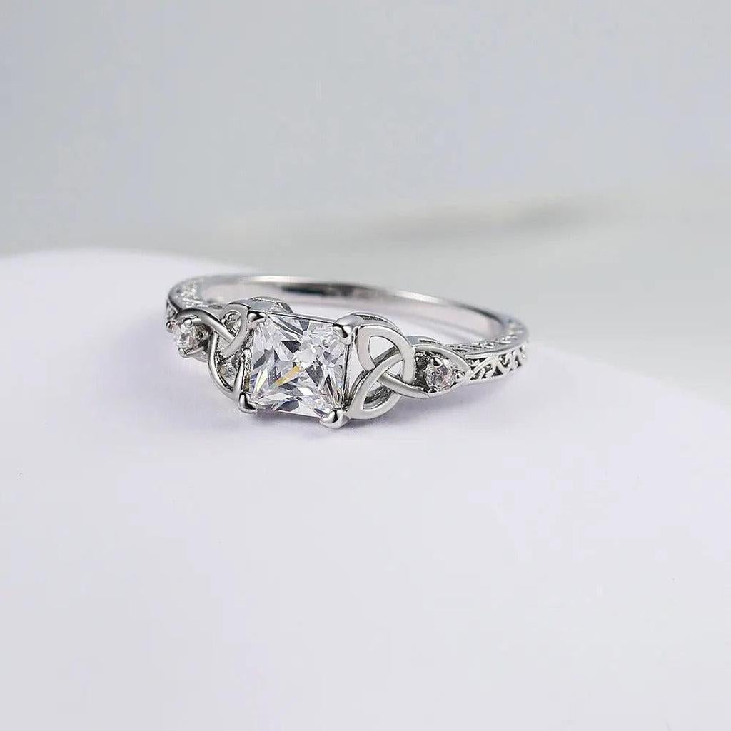 Ring with Knot Design and Stone in the Centre