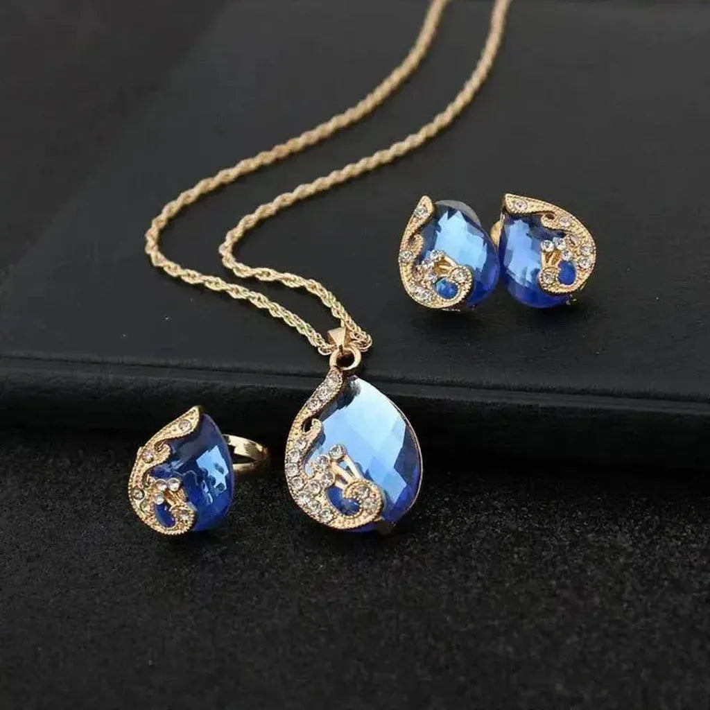 Set: Necklace and Earrings with Blue Crystal in Gold
